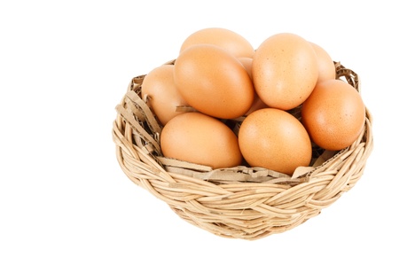 egg in basket isolated on white backgroundの写真素材