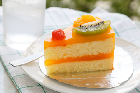 Orange cake and slice kiwi fruitの写真素材