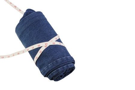 jeans and measure tape isolated white backgroundの写真素材