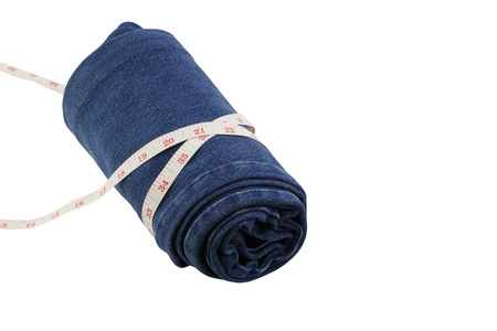 jeans and measure tape isolated white backgroundの写真素材