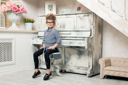 The girl playing on the pianoの写真素材