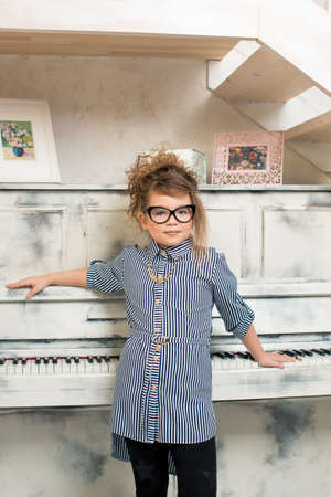 The girl playing on the pianoの写真素材