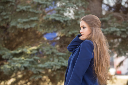 beautiful girl student in the blue coatの写真素材