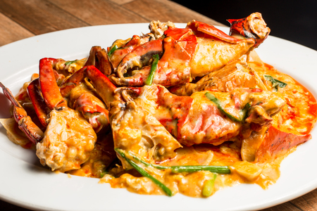 Stir-Fried Sea Crab with Curry Powder Sauce, Milk and Eggs. A popular Thai-Chinese seafoodの写真素材