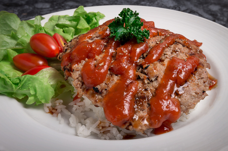 Hamburger meat with rice and saladの写真素材