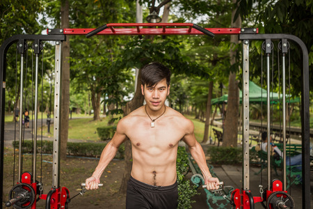 A young sportsman getting ready for athletic and fitness training outdoors. Healthy lifestyle concept with sunrise early morning.の写真素材