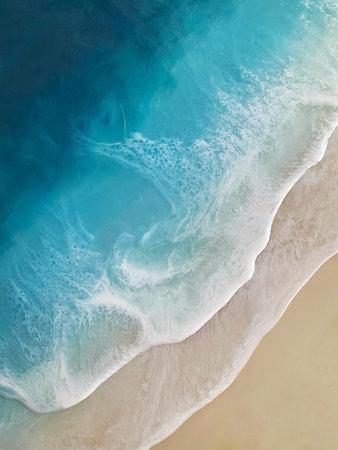 Top view on sea wave with white foam and light beige sand. Fluid, pour drawing of epoxy resin....