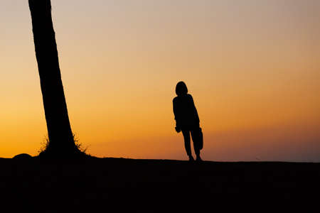 woman standing on mountain topの写真素材