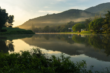 beautiful morning with rising sun on lakeの写真素材