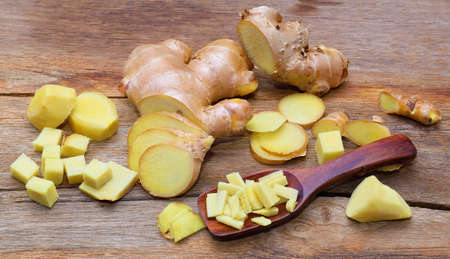 fresh ginger on wooden tableの写真素材