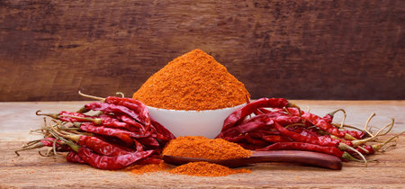 Chili with cayenne peppers on a wooden floor.
