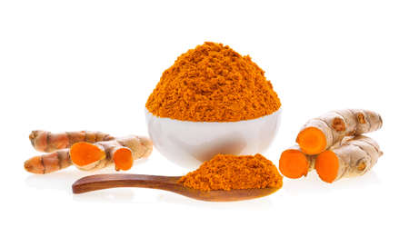 Turmeric roots with turmeric powder on white backgroundの写真素材