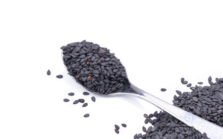 black sesame seeds isolated on white backgroundの写真素材