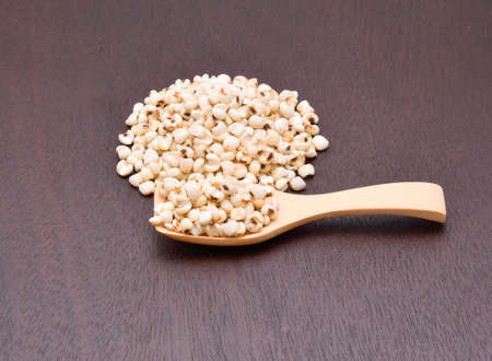 millet grains on the wooden floorの写真素材