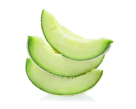 Slices of melon isolated on white background.の写真素材