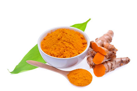 Turmeric roots and turmeric powder on white backgroundの写真素材