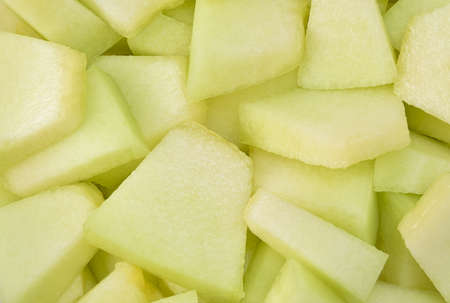 Cantaloupe melon slices, full frame food background.の写真素材