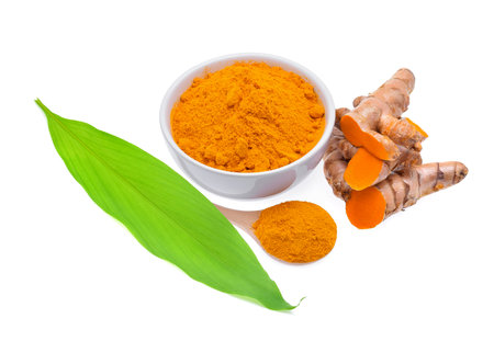 Turmeric roots with turmeric leaf  and turmeric powder isolated on white backgroundの写真素材