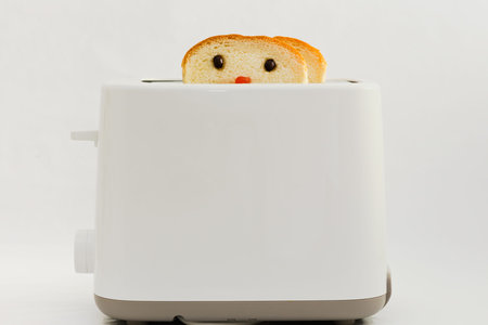 Bread with Cute Face  Decorated by coffee bean as the eyes and strawberry jam as nose  Baking in...