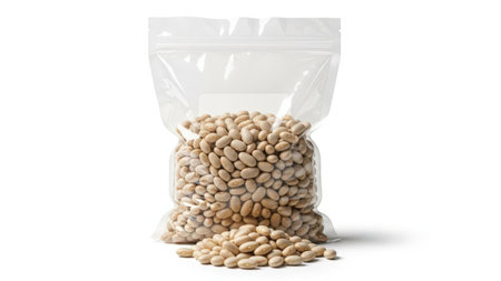 This image features a clear plastic bag filled with various types of beans. The bag is sealed at the top and stands upright, with some beans spilling out onto a transparent background. The image is on a white background, making the beans stand out clearly. This SEO-friendly description helps in searching for bean-related images.の素材
