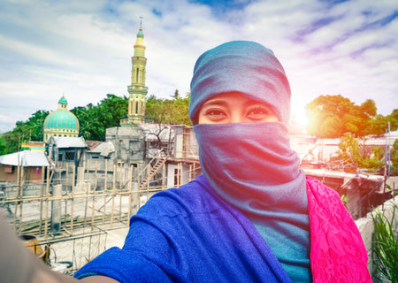 Beautiful muslim woman taking selfie in traditional islamic clothes - Young arabic girl fashion...