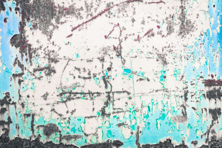 Gray rusty background with aquamarine peeling paint stains - Light blue and white natural weathered  iron panelの写真素材