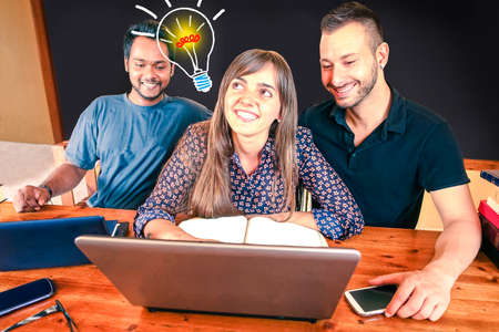 Multiracial creative team with lightbulb of fresh ideas coming up - Inspired multicultural friends working together at solution using pc - Brainstorm concept - Blackboard background for copy spaceの写真素材