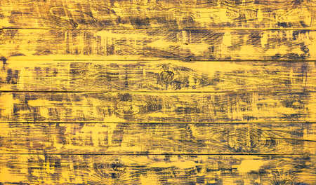 Yellow painted wooden planks - Wood background with golden brush strokes -  Horizontal boardsの写真素材