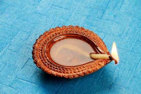Hindu Festival Diwali Diya on Blue Background