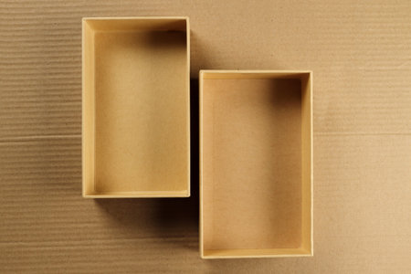 Open Recycled CardBoard Box on Corrugated Background
