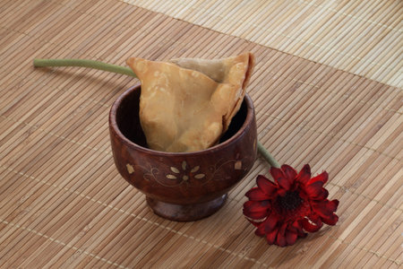 Indian Food Spicy Samosa with a flowerの写真素材