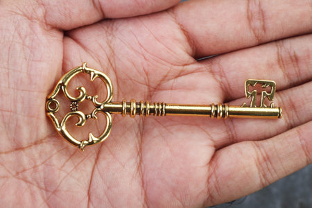 Vintage / Retro Golden Key in a Hand