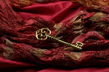 Golden Vintage Luxury Key on Red Royal Fabricの写真素材