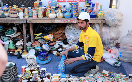 New Delhi, India - February 15, 2020 - A Seller at the Hunar Haat. An exhibition of Artisans / Craftsmen and Culinary Artists held in different parts of India.のeditorial素材