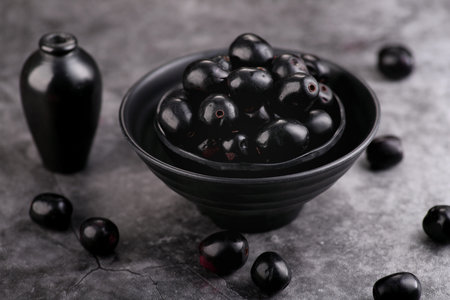 Indian Black Berry or Jamun Fruit in a Black Bowl - Healthy Fruit