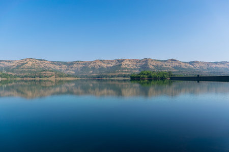Panoramic view of beautiful Panshet dam on a sunny morning. The dam is located in Pune, Maharashtra, Indiaの写真素材