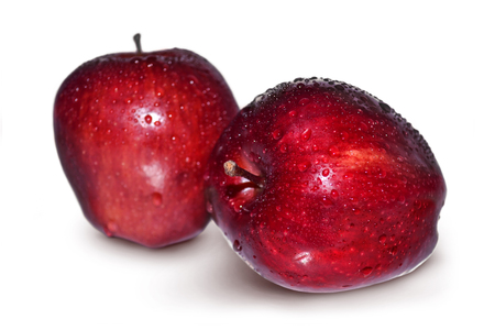 Fresh red apple with drops on white backgroundの写真素材