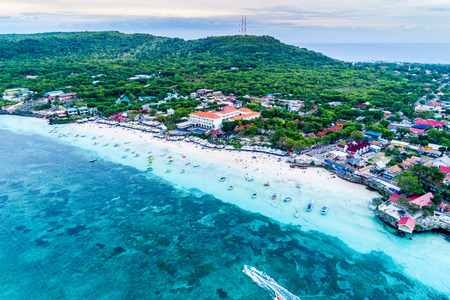 Aerial View of Tanjung Bira Beach, Sandy Beach with Tourists Swimming in Beautiful Clear Sea Water,  South Sulawesi Indonesiaの写真素材