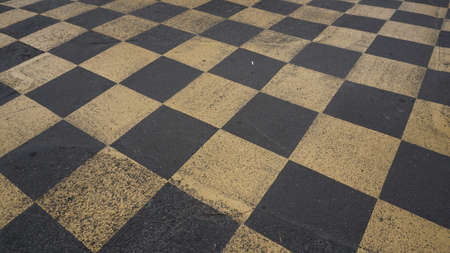 Top view of the asphalt of a car racing pit stop with painted signs and marks. Yellow and Black.の写真素材