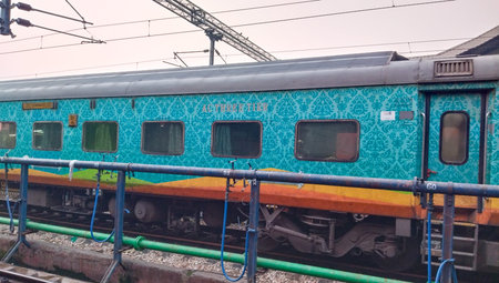 Ac biggie of Indian railway.  The Indian railways train on running on track.