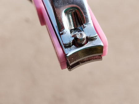 pink nail clipper with blurry background.の写真素材
