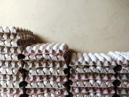 Stack of Fresh chicken white eggs in a cardboard egg tray on a store
