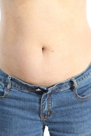 An older woman shows off her bare belly after exercising