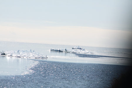 Mass of ice chunks formed on a sand bar in the shallows of a big lake.の写真素材