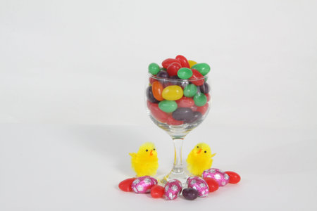 Wine glass filled with different colored candies