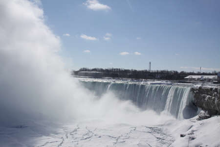 Horseshoe Falls at Niagara falls during winter months. mist rising, Ice forming above, below, and beside rushing waters.の写真素材