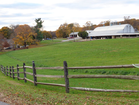 Old wooden fence along a roadway between the lane and pasture.の写真素材