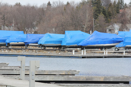 Boats with a covering of shrink wrap for protection from the winter weather in North Americaの写真素材