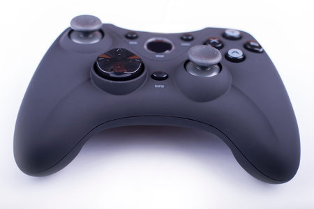 black gamepad close up isolated on a white background