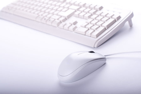 white mouse and keyboard close up on white backgroundの写真素材